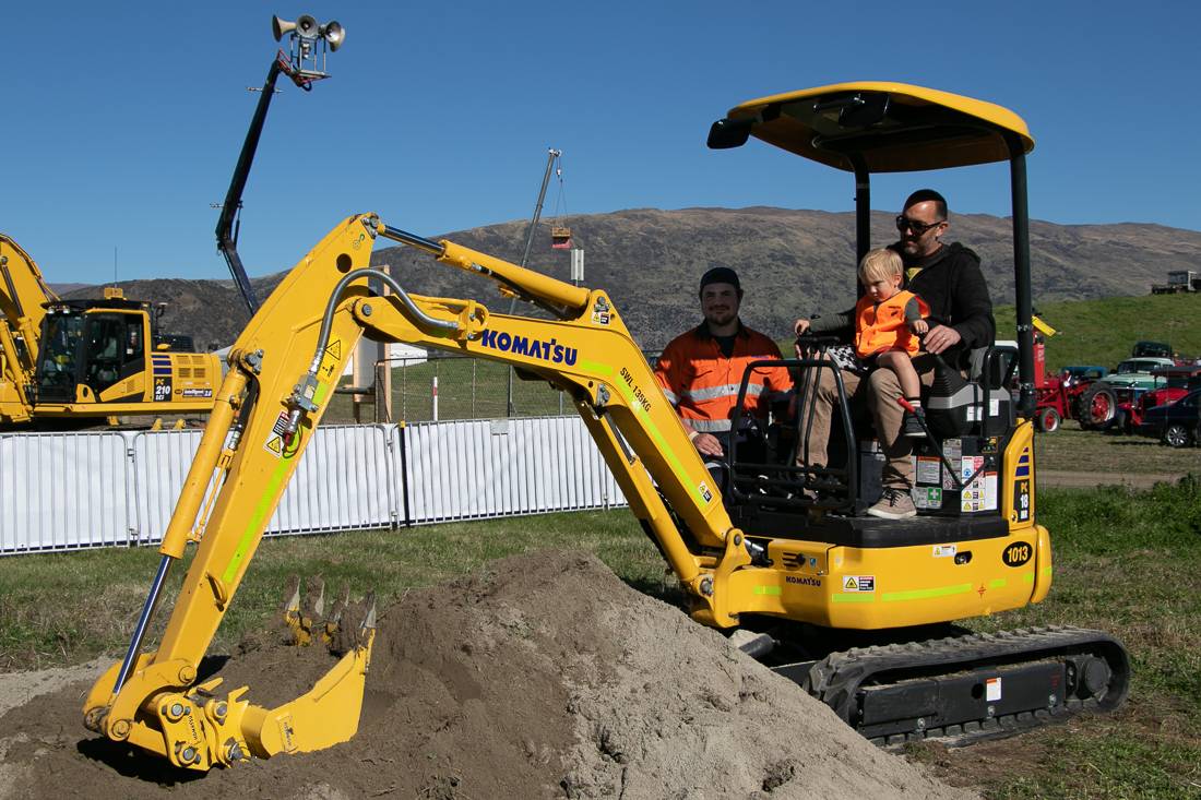 Child on Komatsu PC18 mini digger